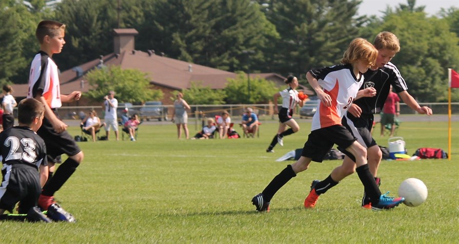 Children playing soccer